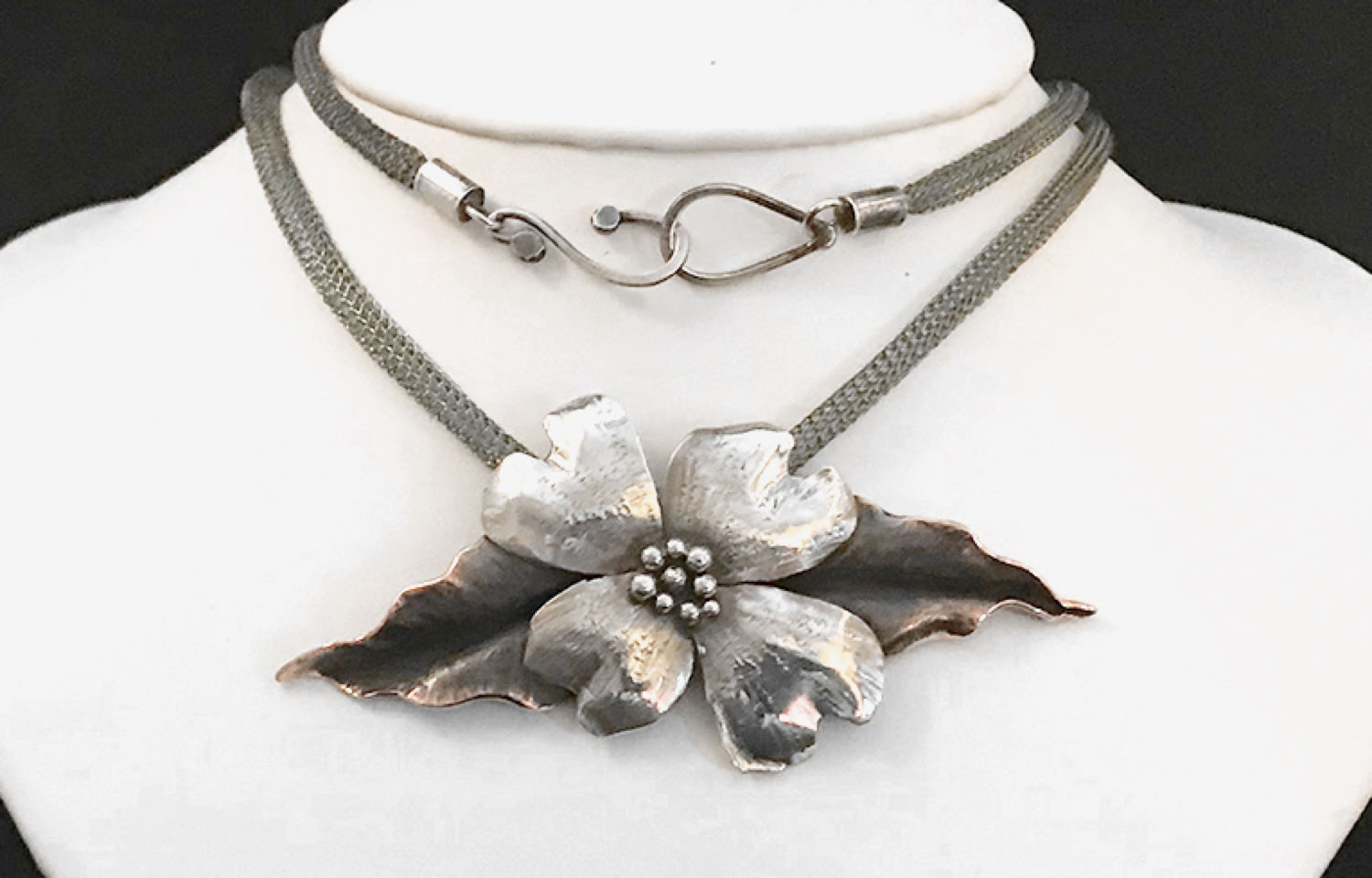 Bonnie North Large dogwood blossom with copper leaves