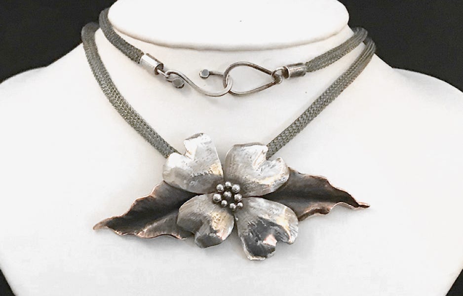 Bonnie North Large dogwood blossom with copper leaves