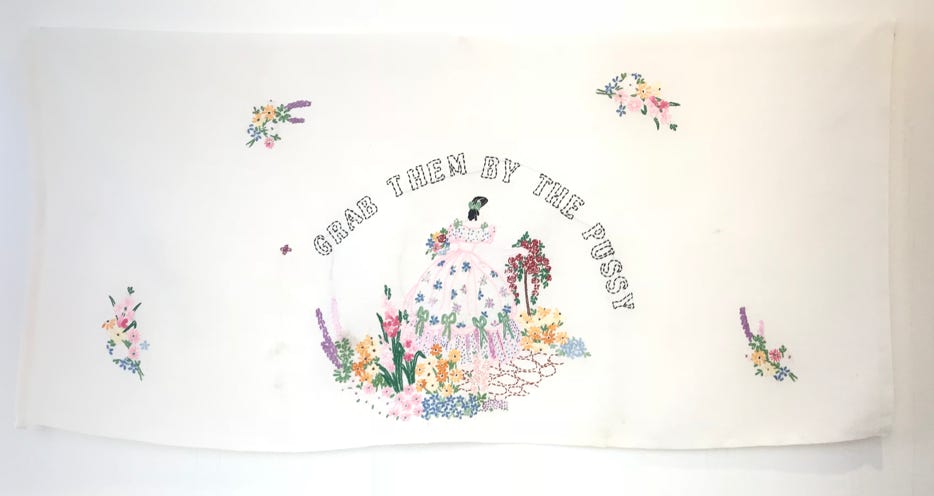 Corinne Greenhalgh Grab them by the pussy 2018 Embroidered text on found linen 