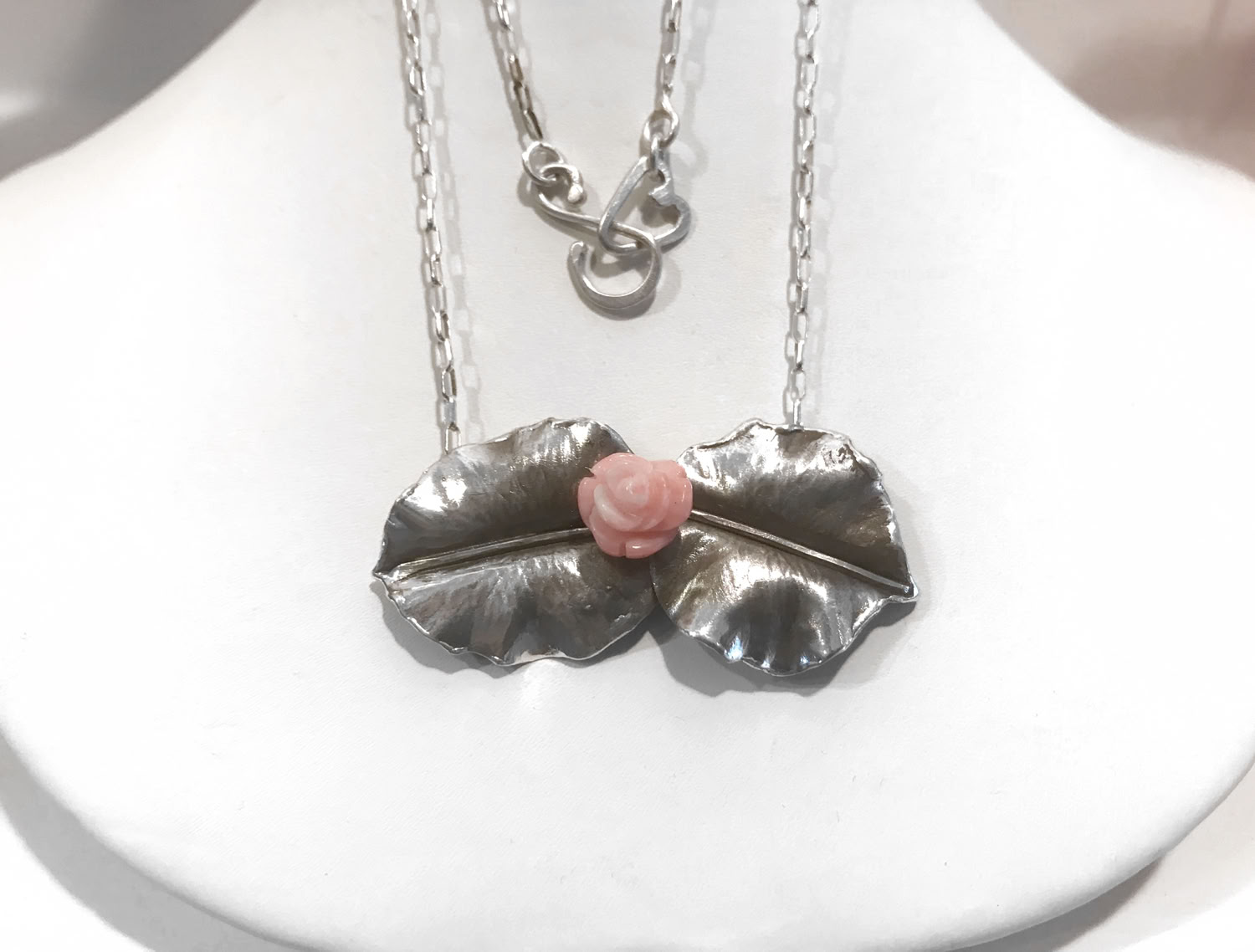 Bonnie North Twin leaves with coral flower